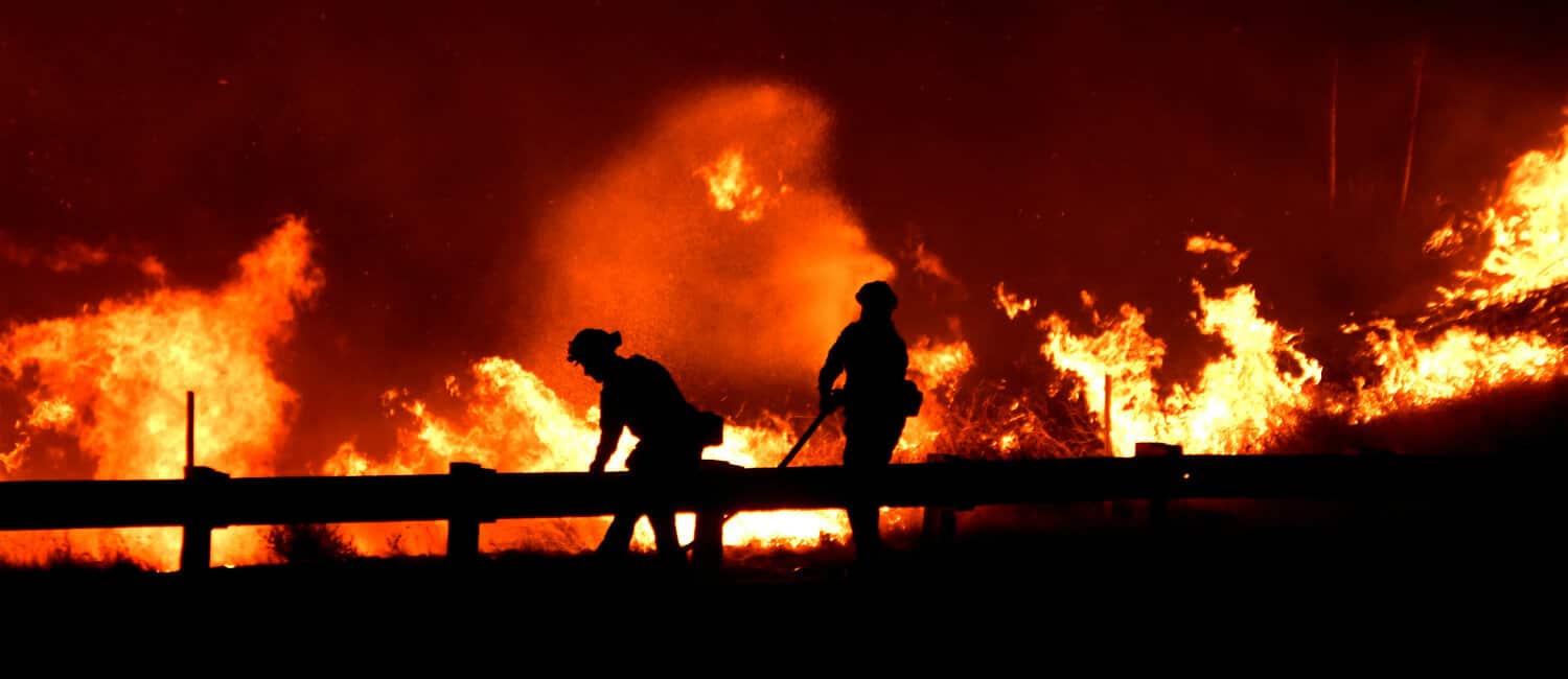 Firefighters battle a wind-driven wildfire Oct. 25, 2019, in Canyon Country near Los Angeles.