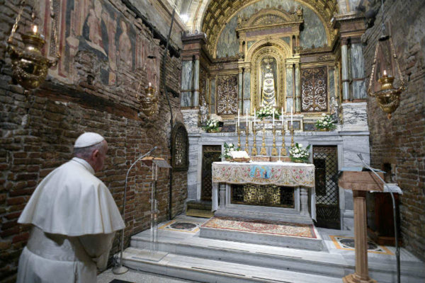 Pope Francis prays before a statue of Our Lady of Loreto at the Sanctuary of the Holy House on the feast of the Annunciation in Loreto, Italy, March 25, 2019.
