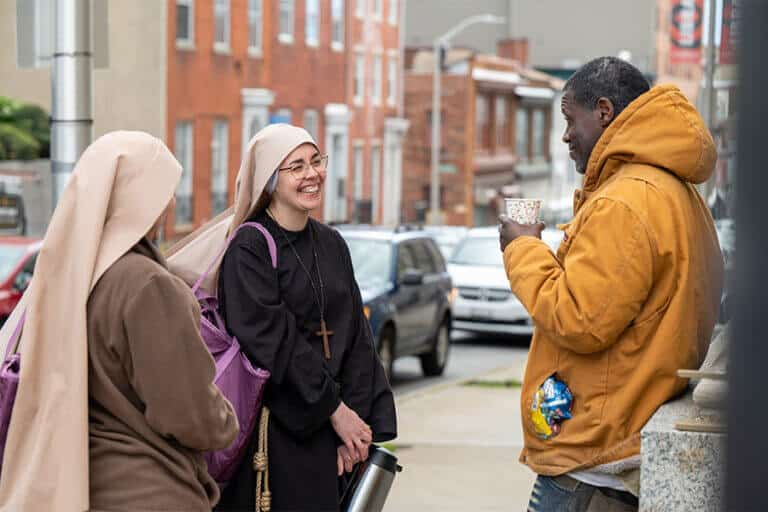 Sisters standing on street